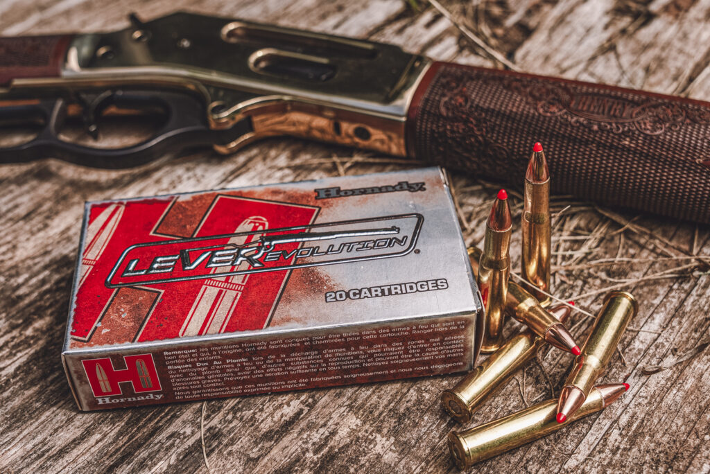 henry 30-30 lever action rifle with hornady ammo a photo of a henry 30-30 lever action rifle with hornady ammo