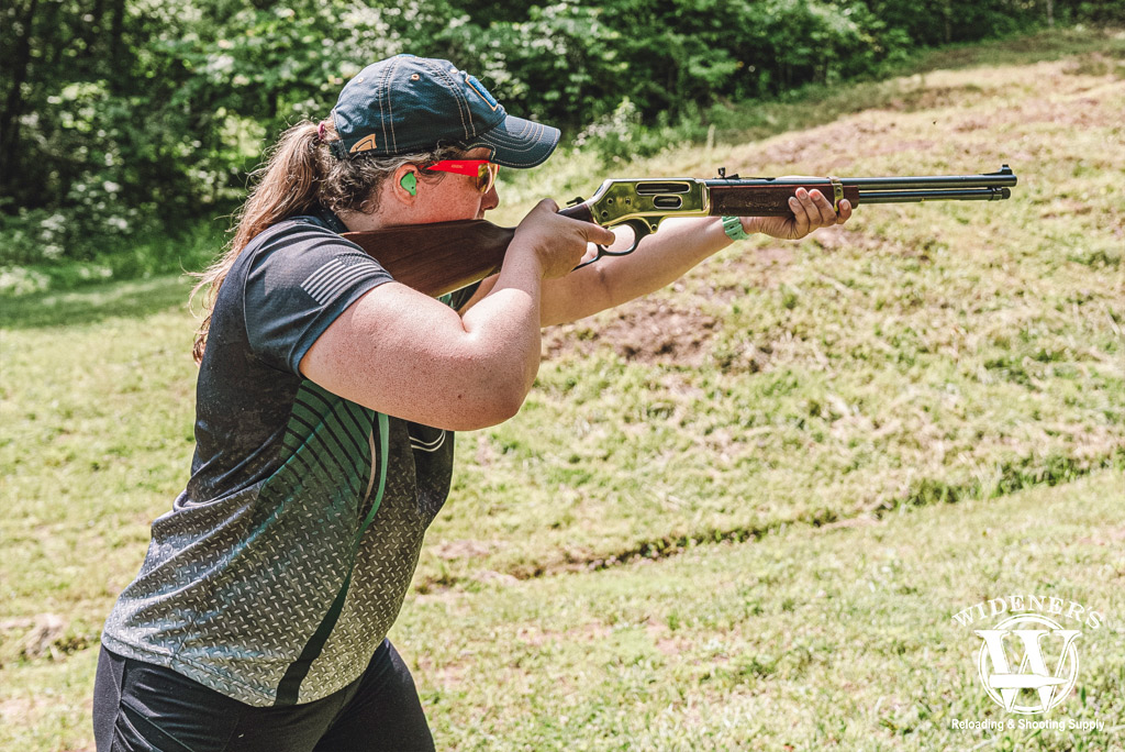 woman shooting a henry 30-30 lever action rifle a photo of a woman shooting a henry 30-30 lever action rifle