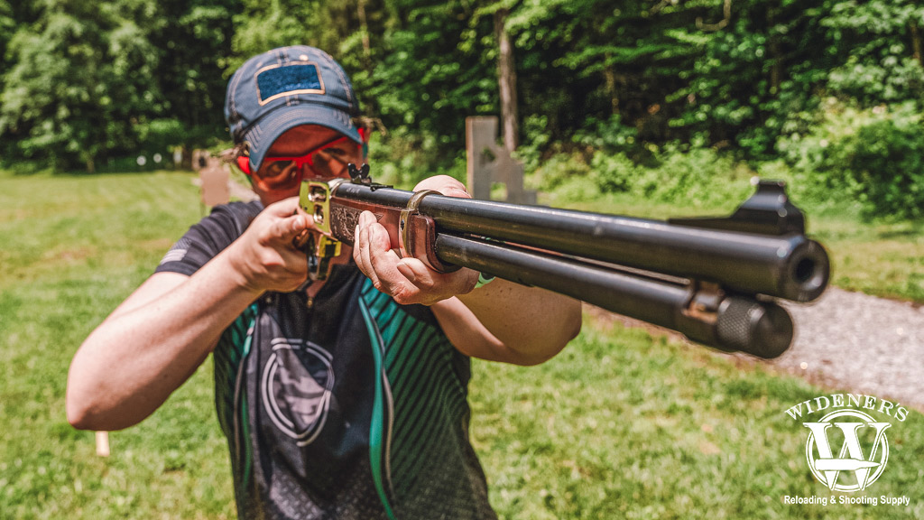 woman shooting a lever action rifle a photo of a woman shooting a lever action rifle