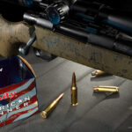 photo of a bolt action rifle and centerfire ammo