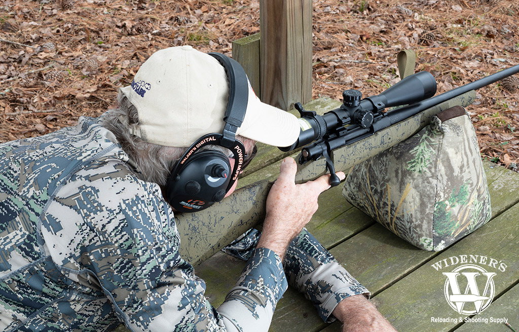 man shooting a bolt action rifle and centerfire ammo a photo of a man shooting a bolt action rifle and centerfire ammo