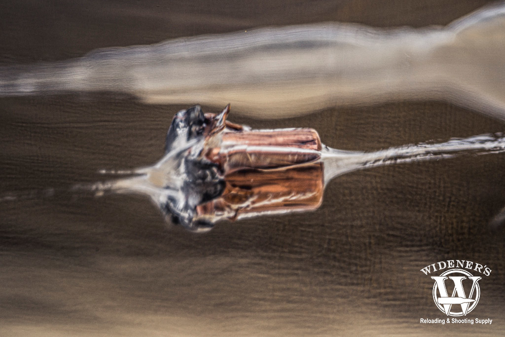 jhp bullet suspended in a block of ballistic gel a photo of a jhp bullet suspended in a block of ballistic gel