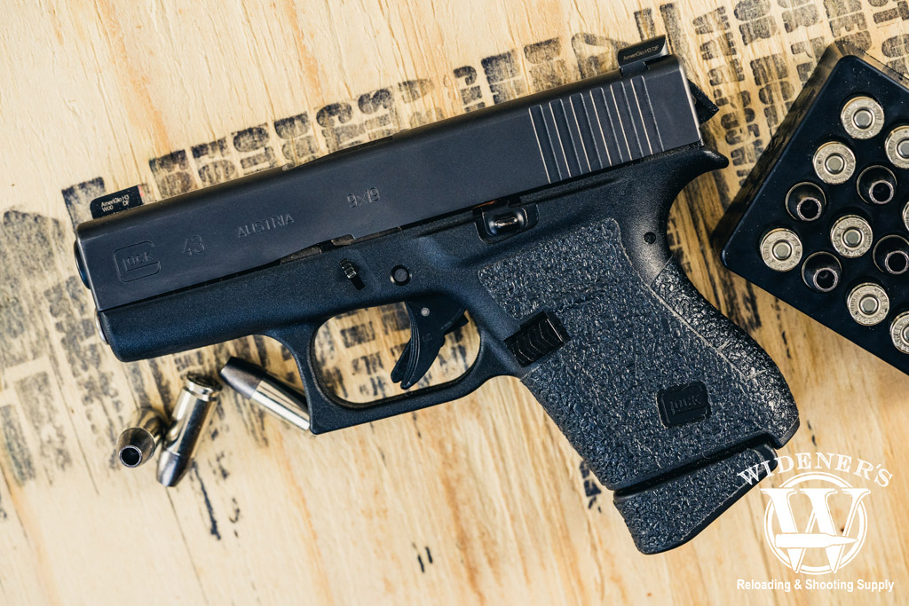 glock 43 handgun with 9mm ammo a photo of a glock 43 handgun with 9mm ammo