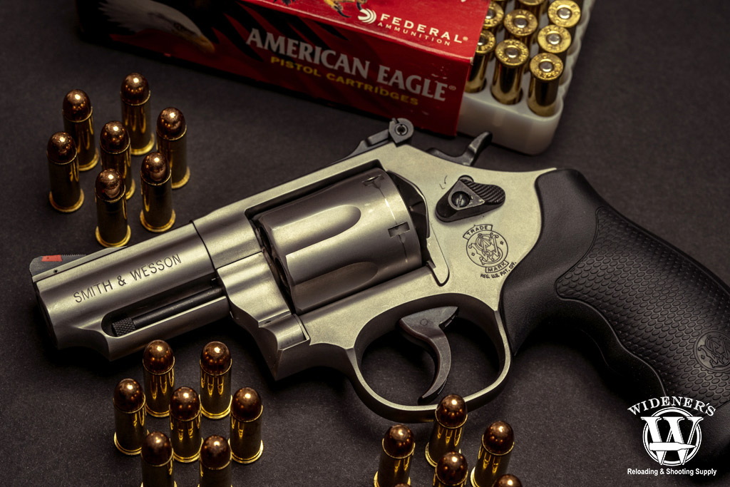 smith & wesson revolver and ball ammo a photo of a smith & wesson revolver and ball ammo