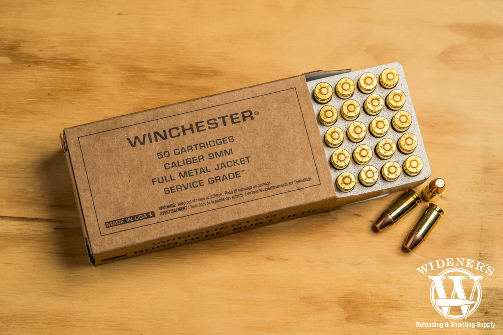 winchester service grade 115gr practice ammo photo of winchester service grade 115gr practice ammo on a sheet of plywood