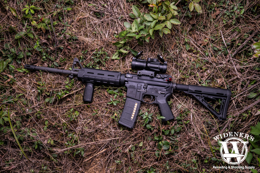 photo of an ar15 rifle with magpul furniture outdoors