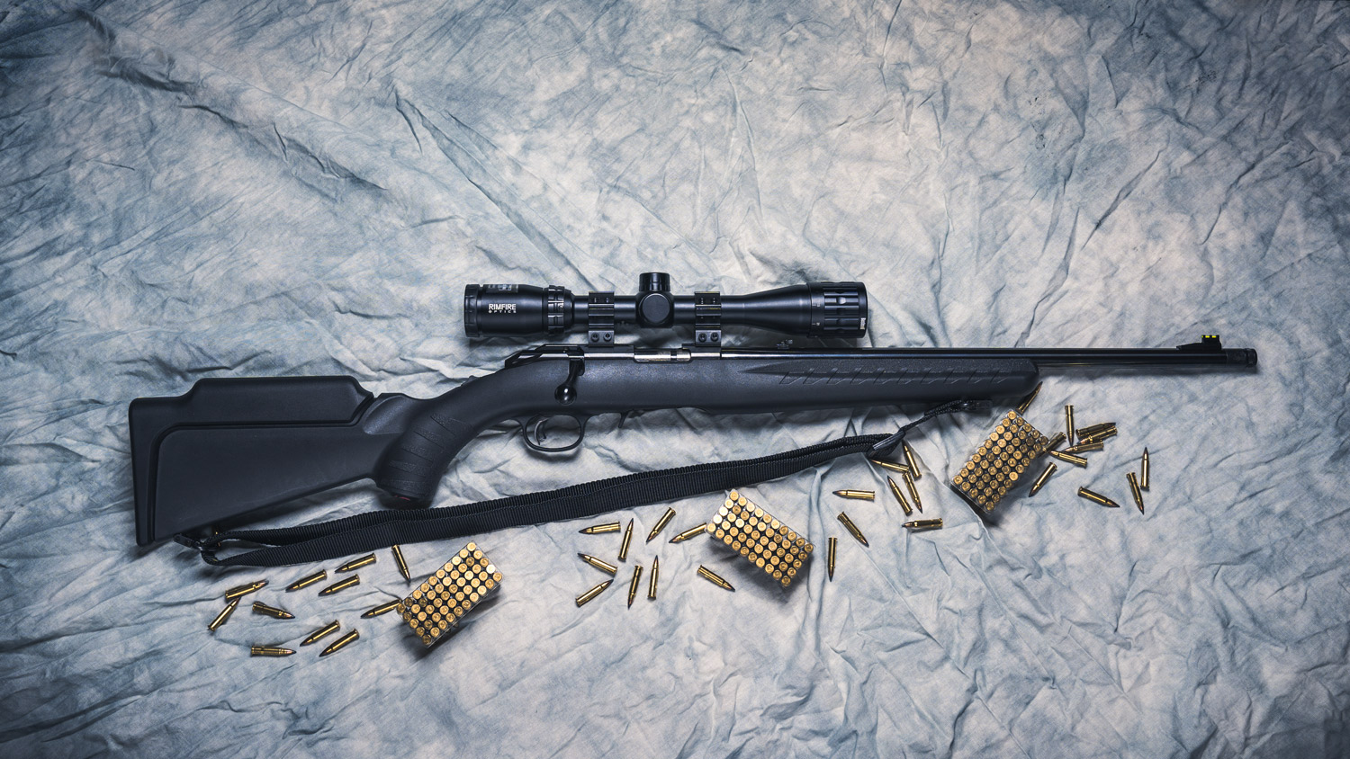 photo of a ruger 17 hmr rifle with ammo