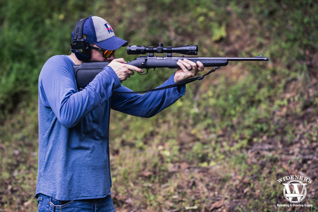 man shooting a bolt action rifle a photo of a man shooting a bolt action rifle