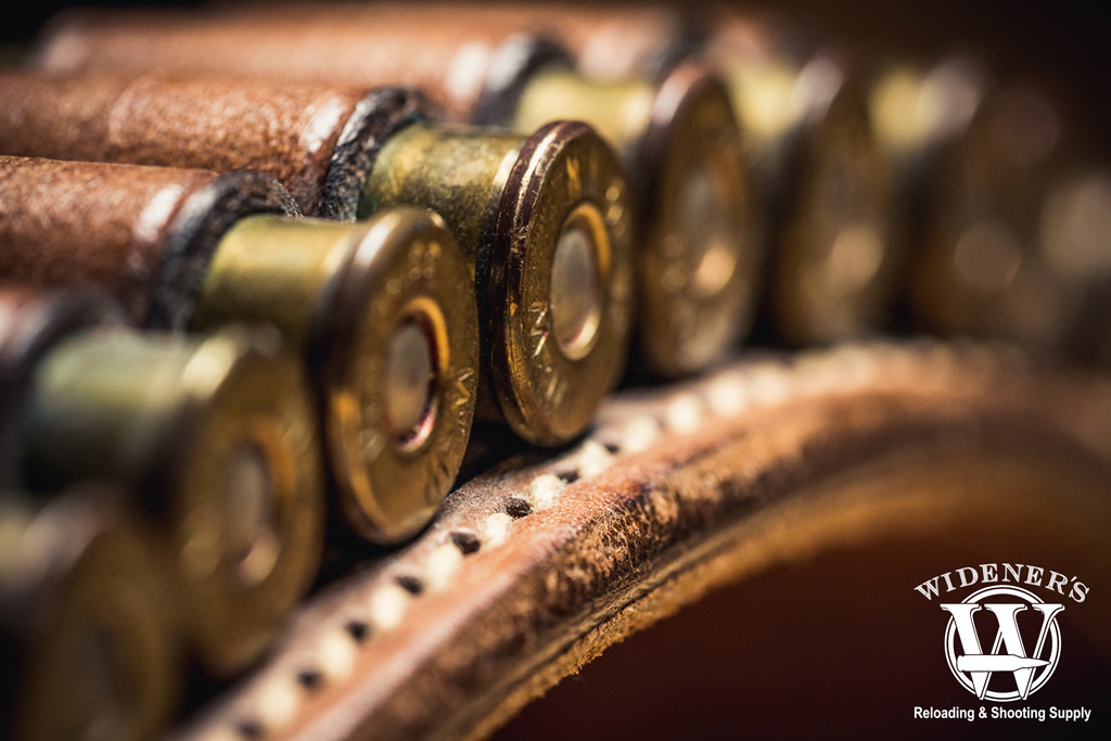 a macro photo of a bullet belt loaded with remington 38-40 ammo