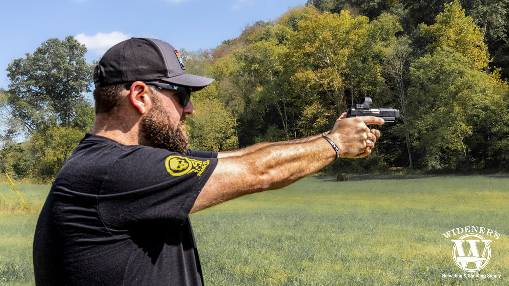 a photo of a man at a gun range