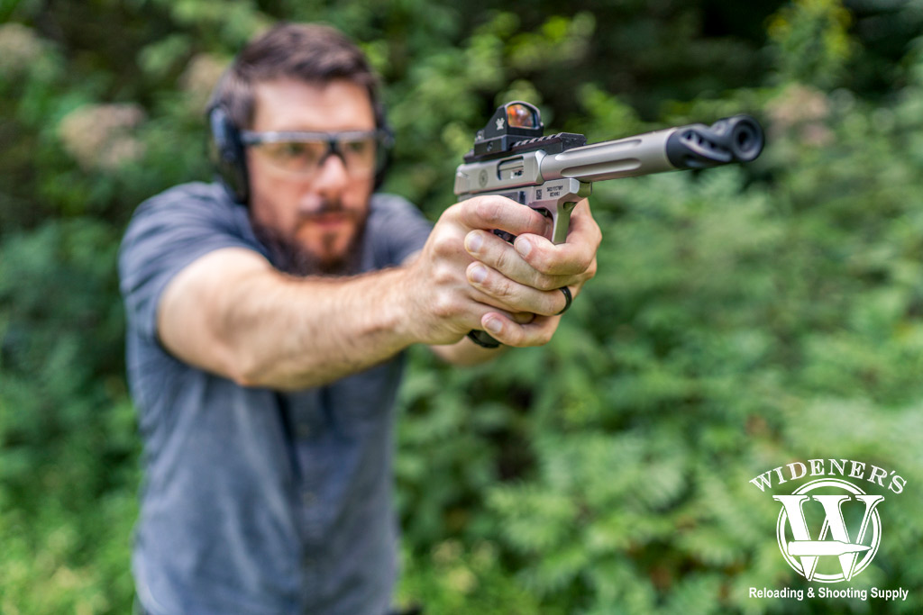 testing the effective range of .22LR with a pistol a photo of a man testing the effective range of .22LR with a pistol