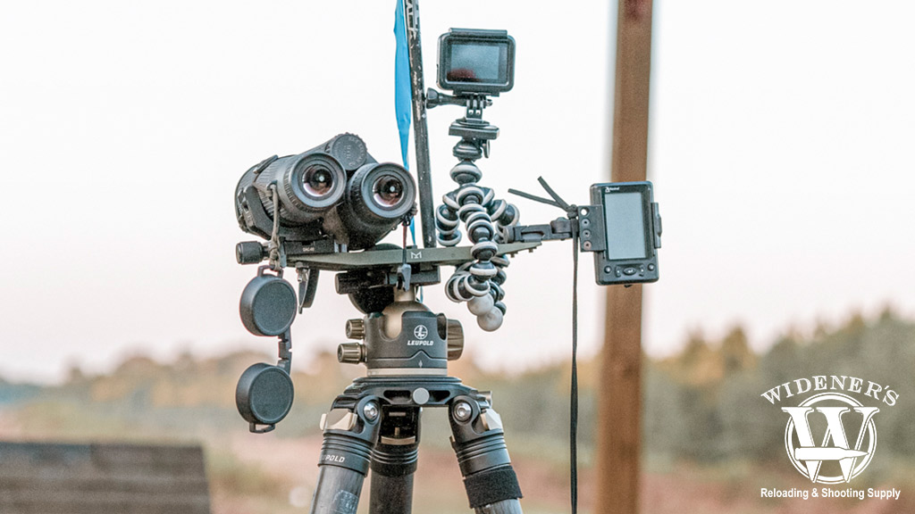 tripod with spotting scope and binoculars a photo of a tripod with spotting scope and binoculars