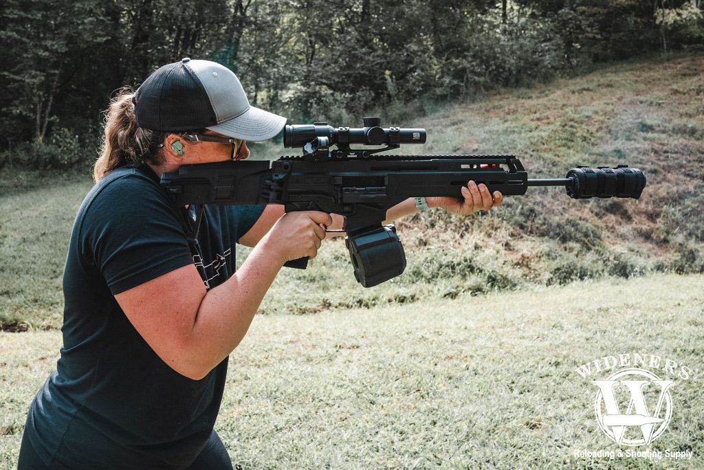 female shooting a rifle at a gun range a photo of a female shooting a rifle at a gun range