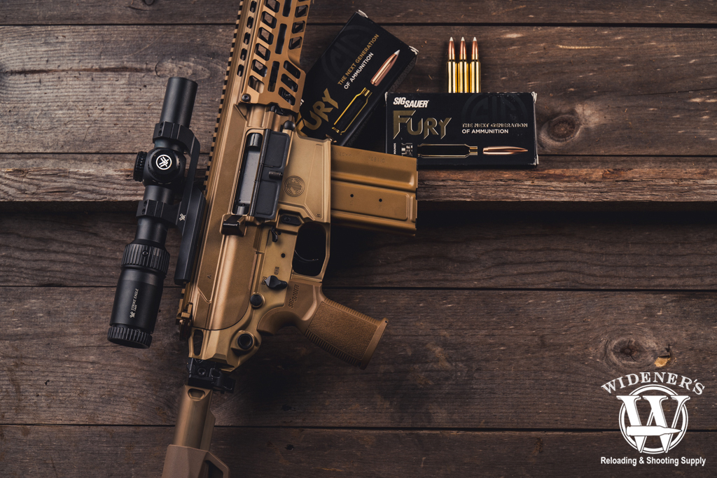 a photo of the sig sauer MCX spear and 277 fury ammo