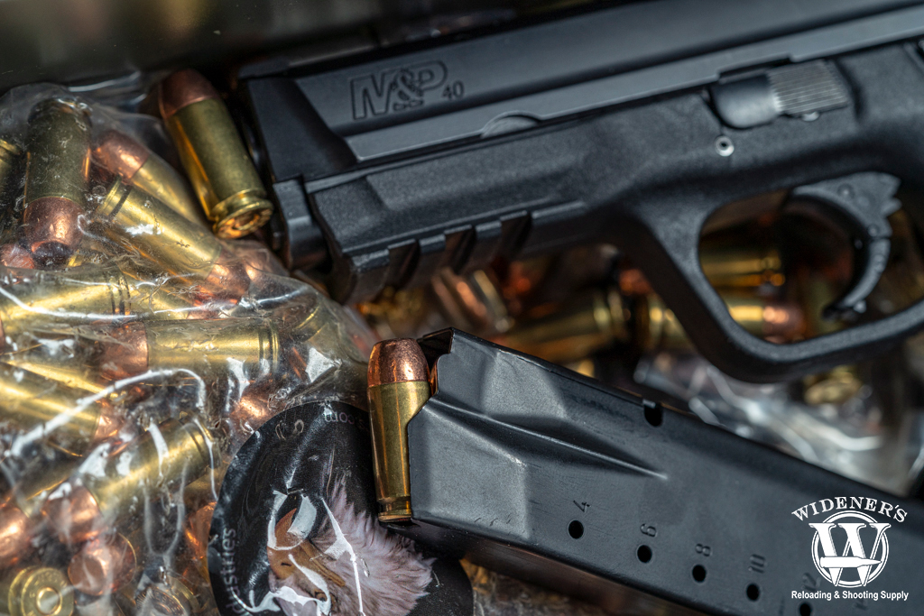 a photo of a S&W M&P handgun with 40 S&W ammo