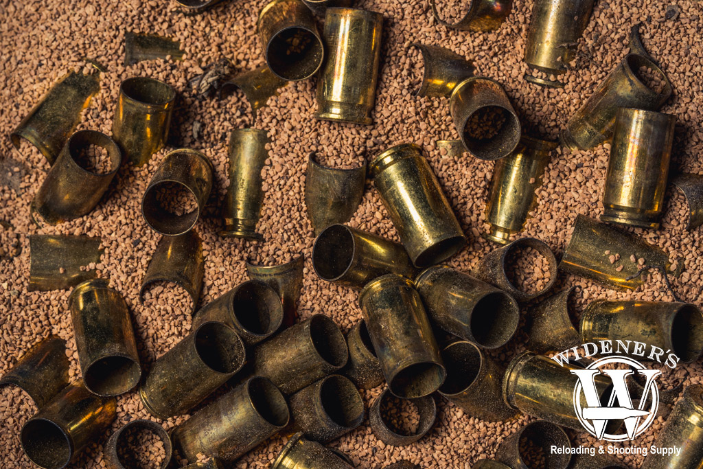 a photo of dirty 9mm brass being cleaned in crushed walnut shells 
