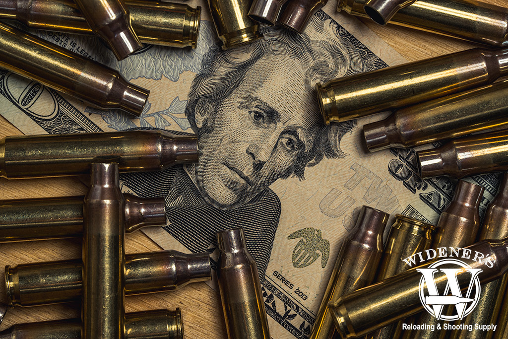a photo of a $20 bill with 223 brass casings for reloading