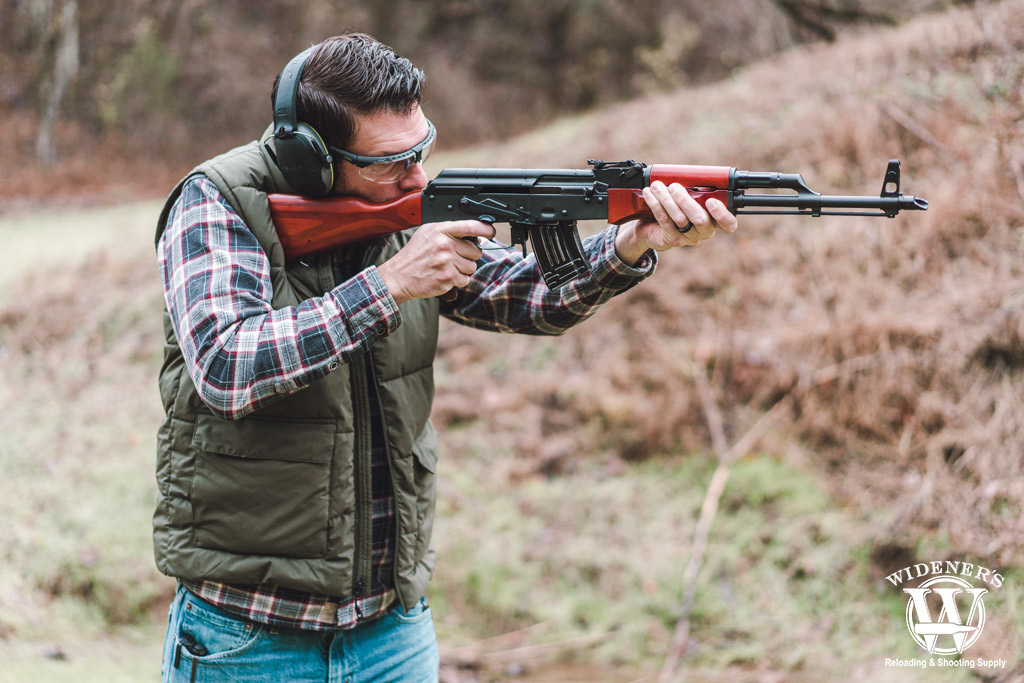 a man shooting an ak-47 rifle a photo of a man shooting an ak-47 rifle