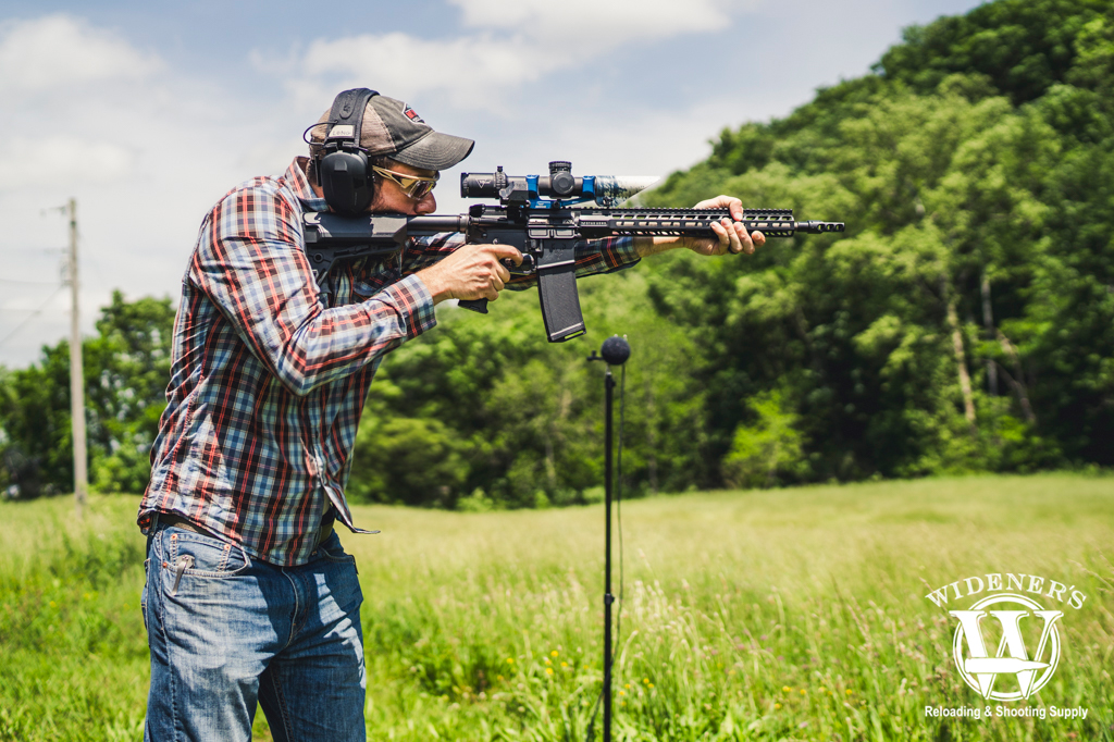 a man shooting an ar-15 rifle a photo depicting how loud is a gunshot with a man shooting an ar-15 rifle