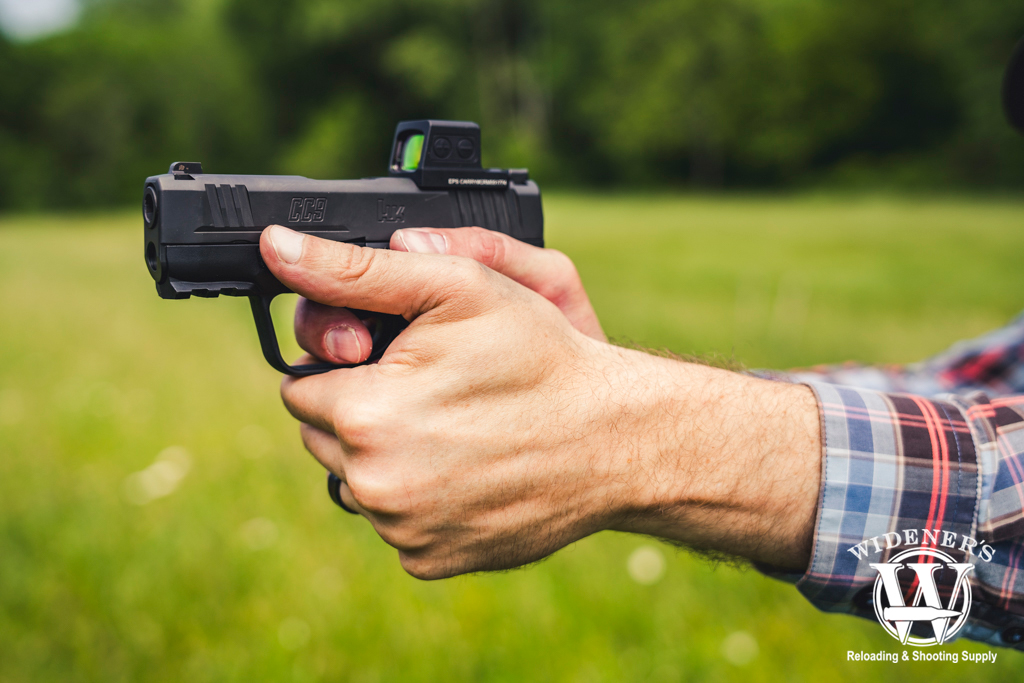 a man shooting an H&K CC9 pistol a photo of a man shooting an H&K CC9 pistol