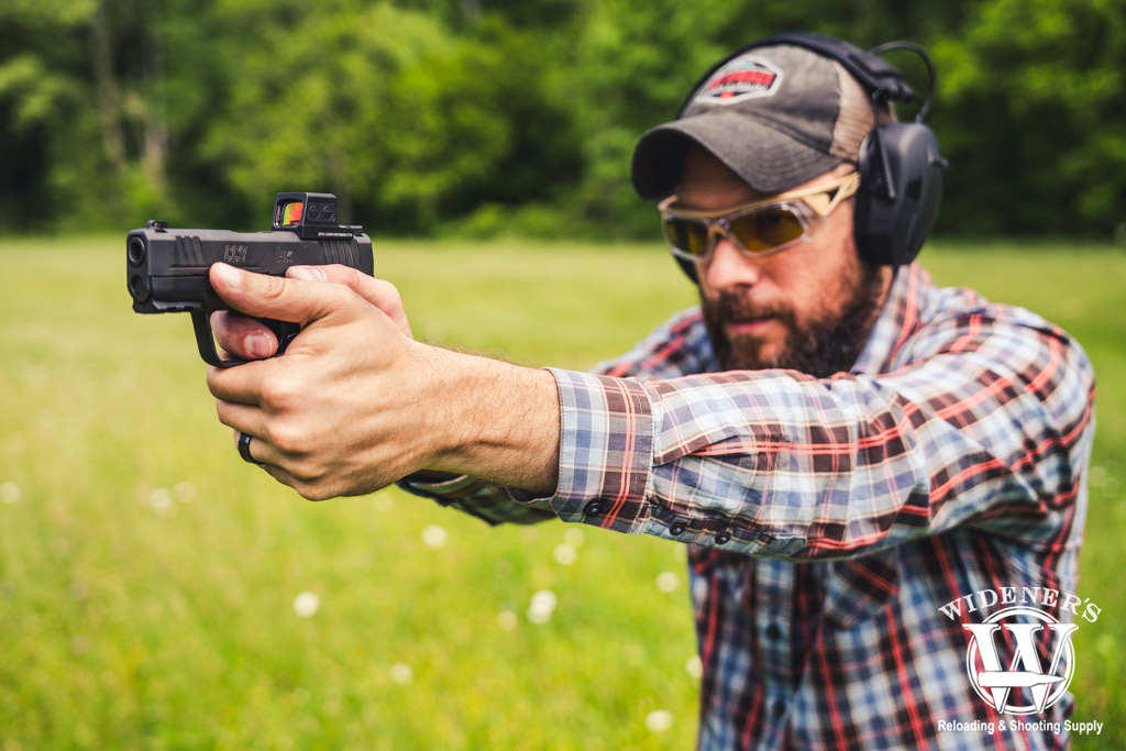 man shooting a H&K cc9 subcompact pistol a photo of a man shooting a H&K cc9 subcompact pistol