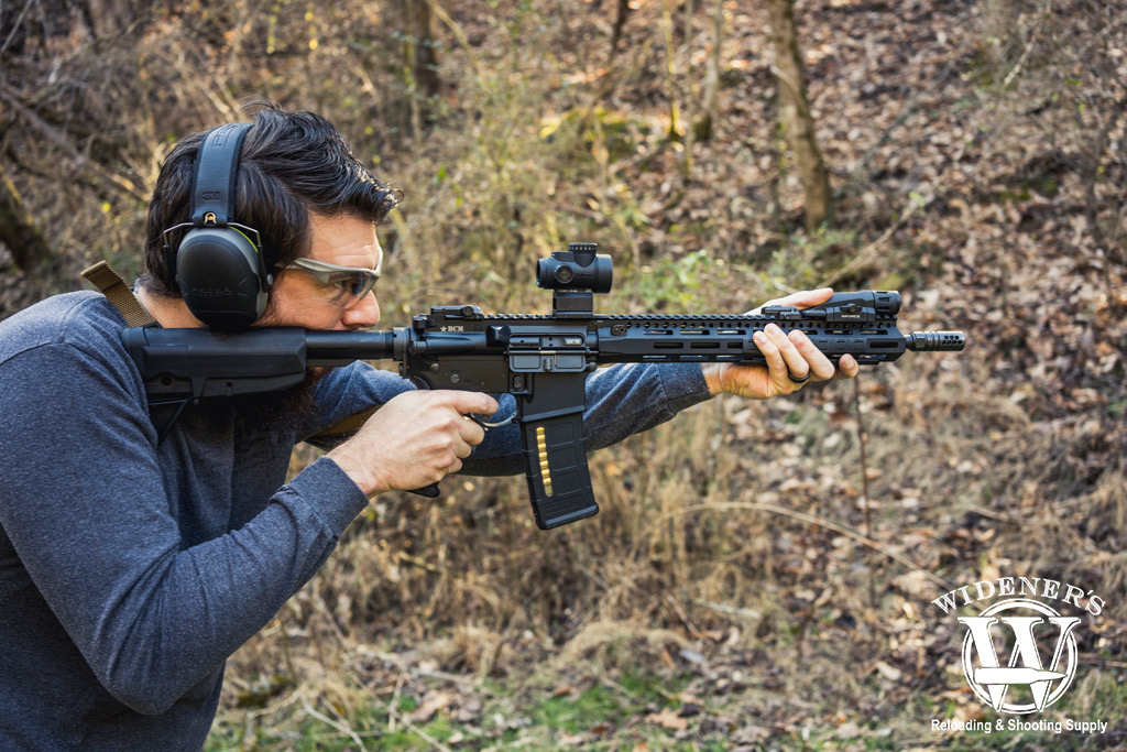 shooting an ar-15 outdoors photo of a man shooting an ar-15 outdoors