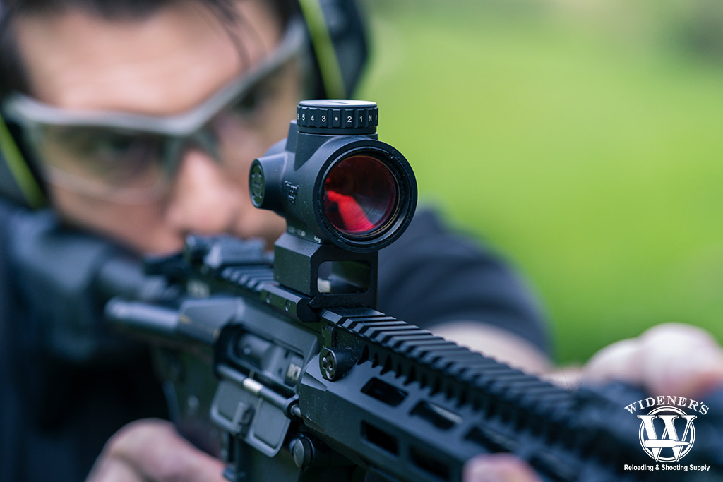 a rifle with a red dot sight a photo of a rifle with a red dot sight