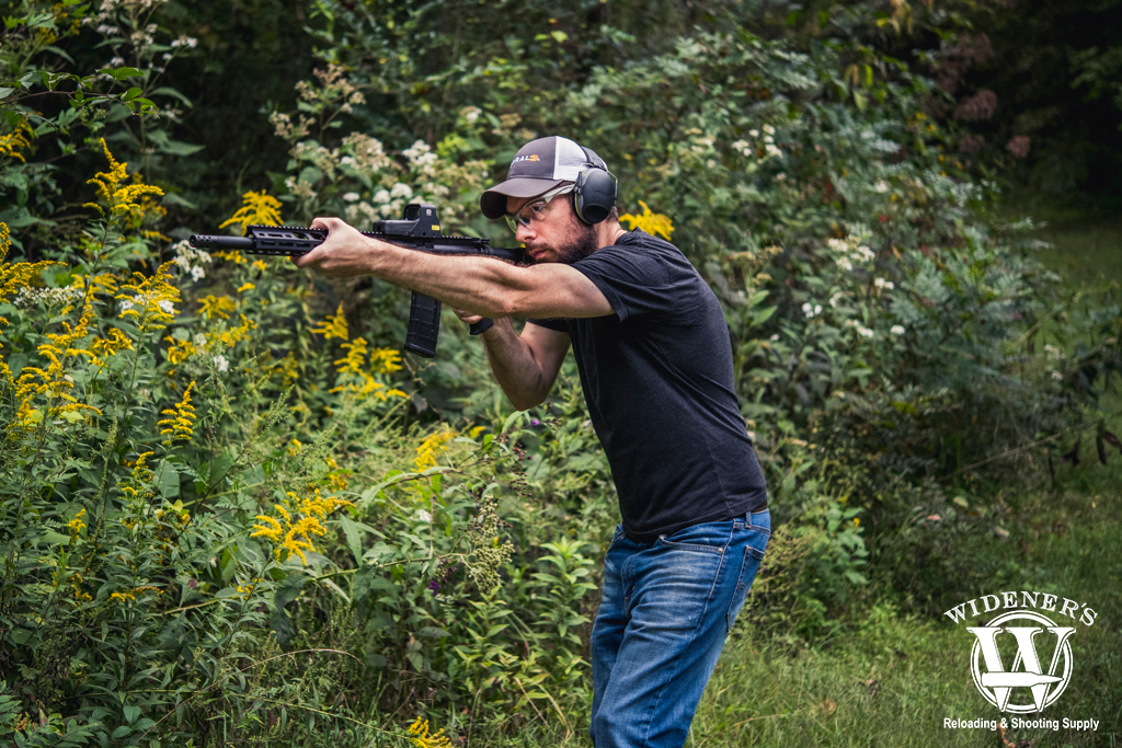 a man shooting an AR rifle a photo of a man shooting 45-70 VS 450 Bushmaster