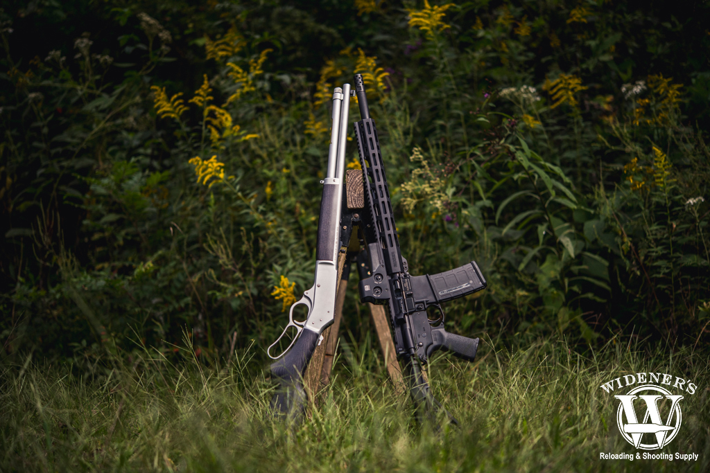 a lever action rifle and an AR rifle a photo of a lever action rifle and an AR rifle 45-70 VS 450 Bushmaster