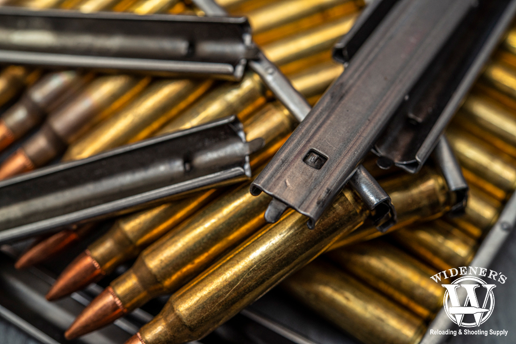 223 rem ammo loaded in a stripper clip a photo of 223 rem ammo loaded in a stripper clip