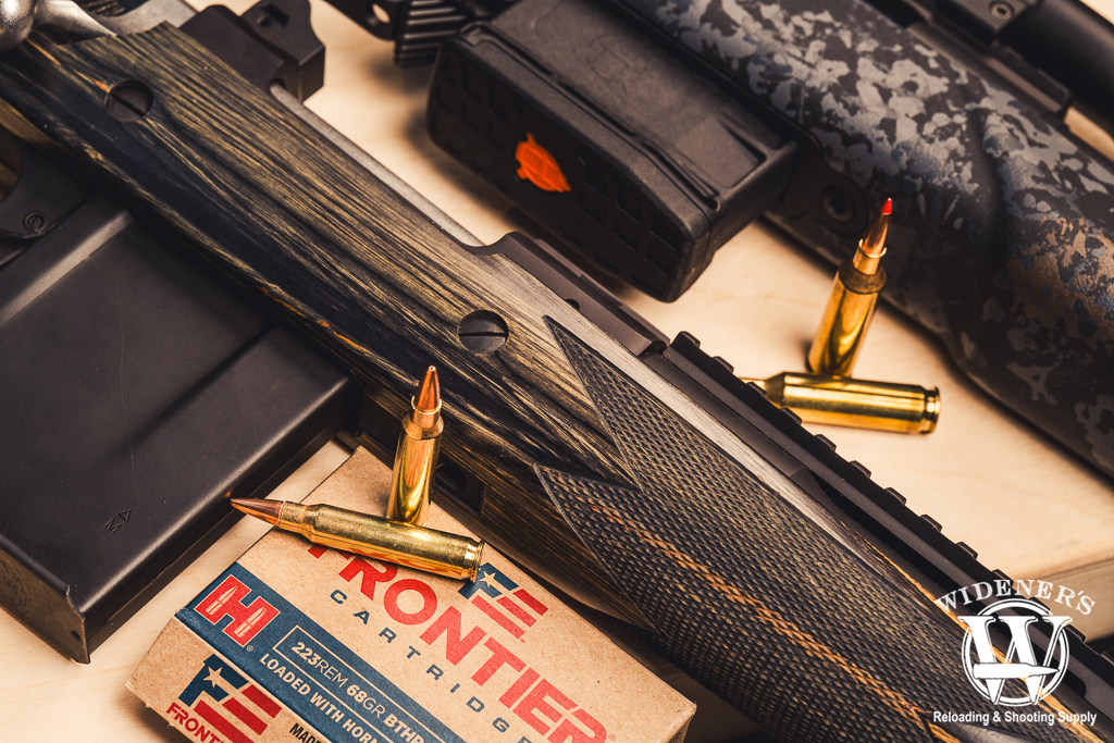 a photo of two bolt action rifles with 22 Creedmoor VS 223 Remington ammo