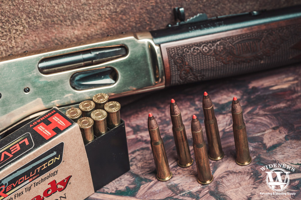 lever action rifle and centerfire ammunition a photo of a lever action rifle and centerfire ammunition