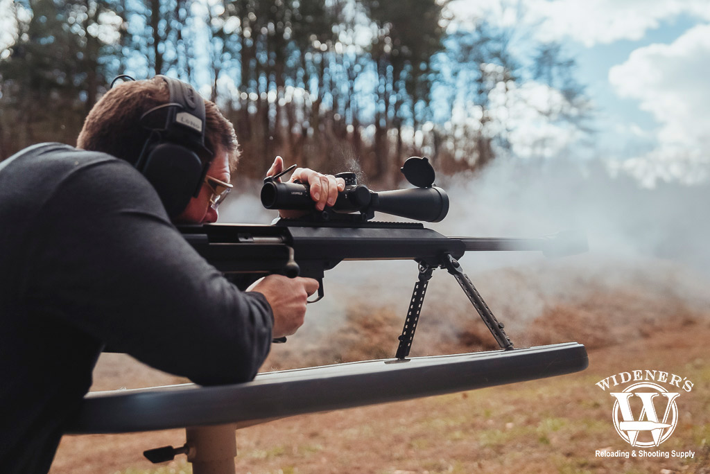 a man shooting a barrett bolt action rifle a photo of a man shooting a barrett bolt action rifle