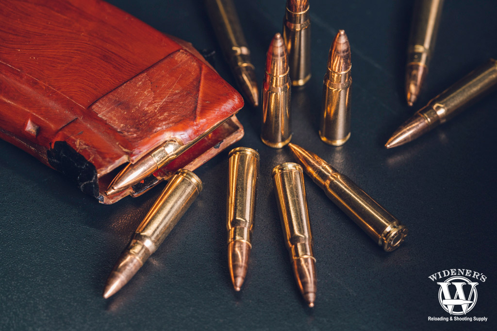 7.62x39 ammo with a bakelite magazine a photo of 7.62x39 ammo with a bakelite magazine