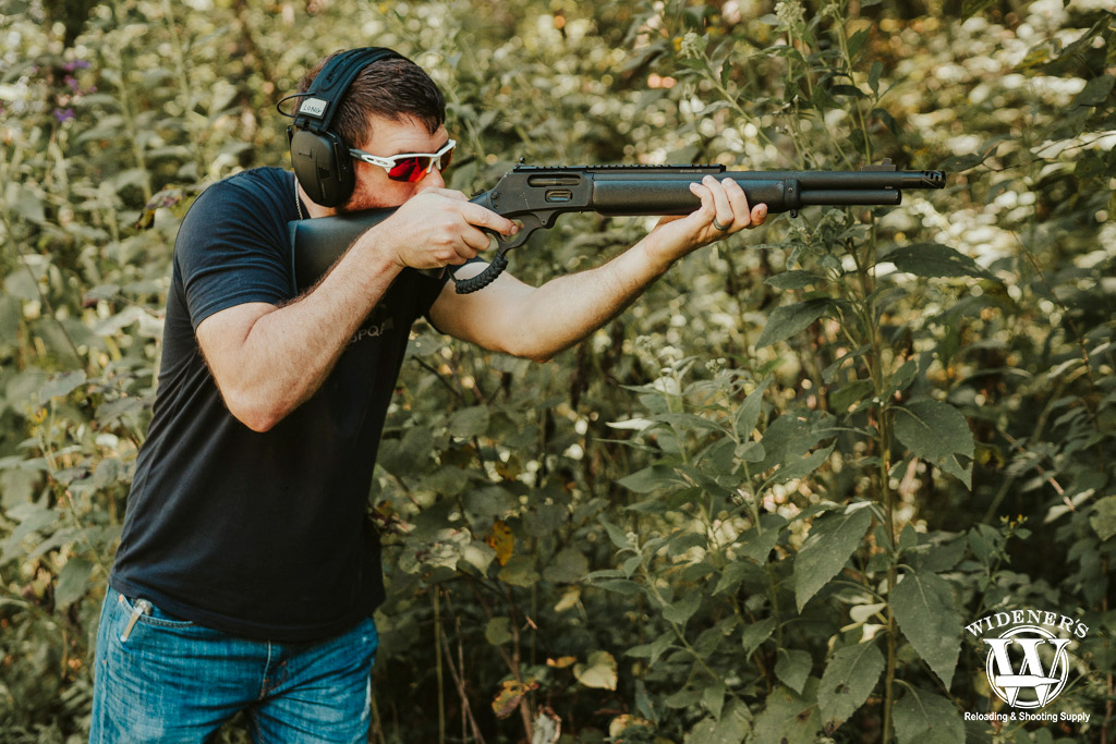 a man shooting a 45-70 lever action rifle a photo of a man shooting a 45-70 lever action rifle