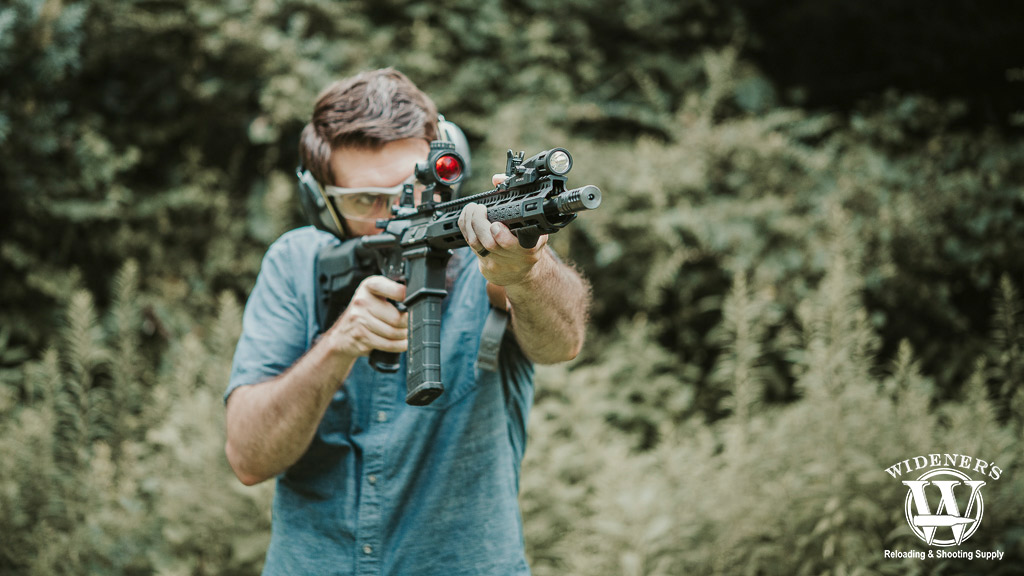 a man shooting an ar-15 rifle a photo of a man shooting an ar-15 rifle
