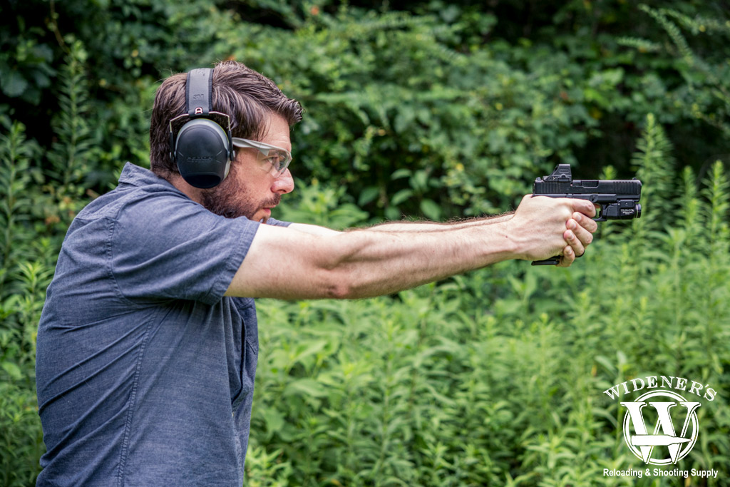 man shooting a 9mm glock handgun a photo of a man shooting a 9mm glock handgun