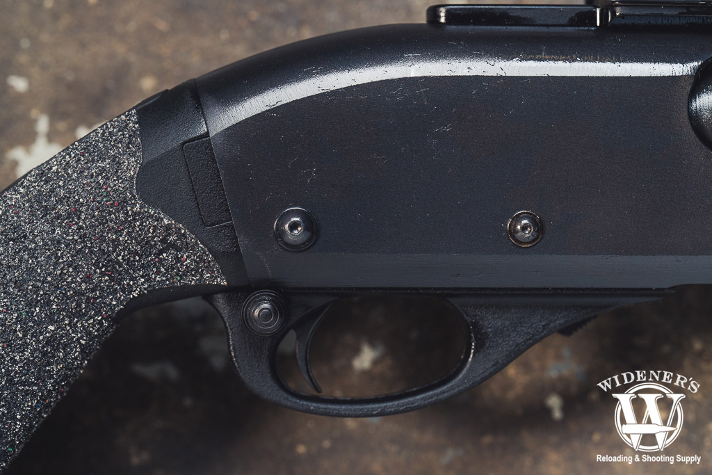 remington 870 with Wilson Combat Dome Head Safety a macro photo of a remington 870 with Wilson Combat Dome Head Safety