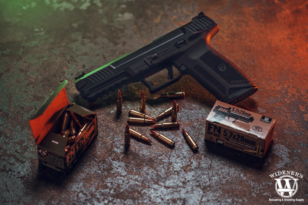 ruger 5.7 centerfire pistol with ammo a photo of a ruger 5.7 centerfire pistol with ammo