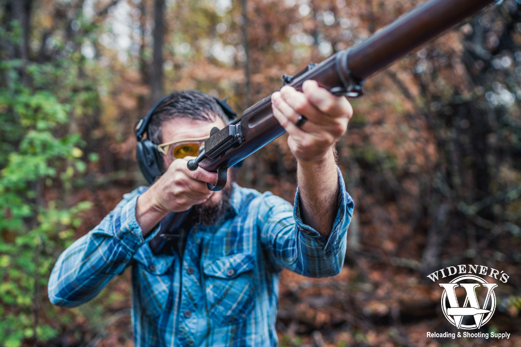 a man shooting a 1889 Krag-Jorgensen rifle a photo of a man shooting a 1889 Krag-Jorgensen rifle