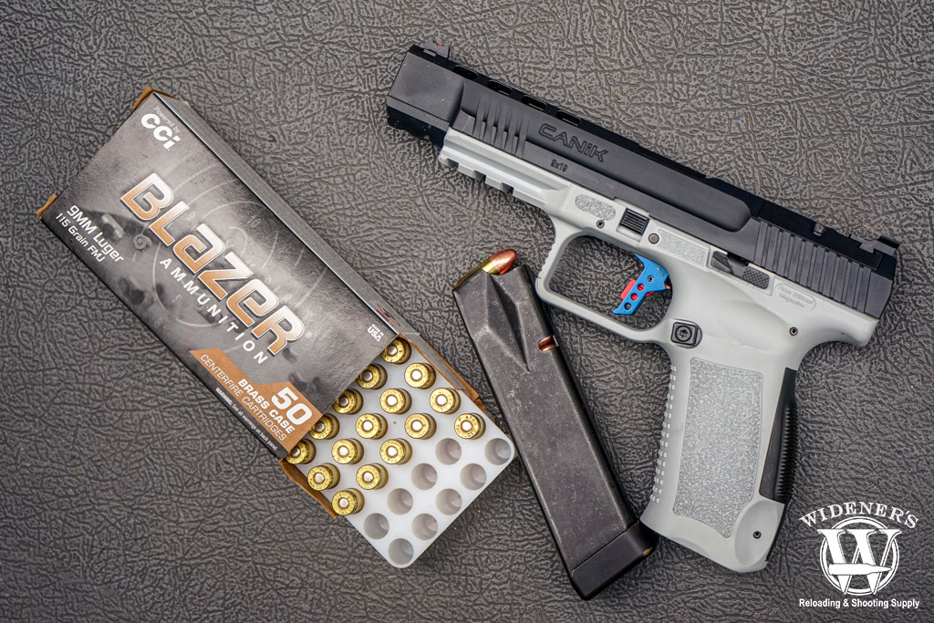 a photo of a canik handgun and 9mm blazer brass ammo