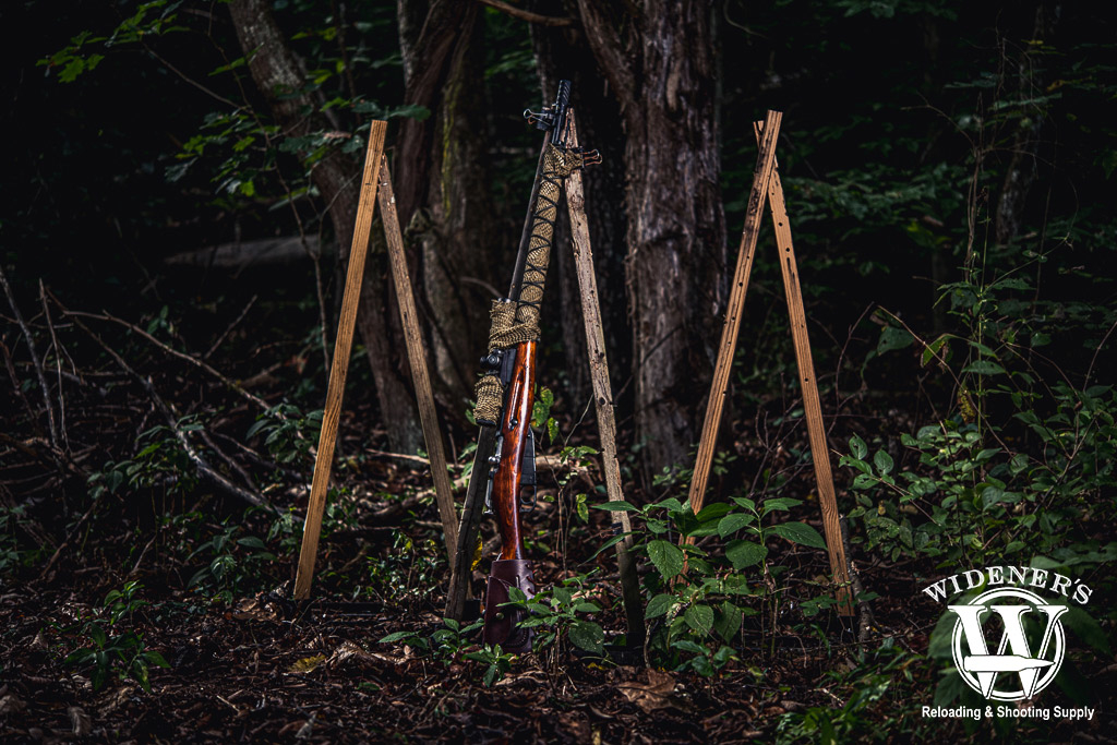 a mosin nagant rifle with a scope outdoors a photo of a mosin nagant rifle with a scope outdoors