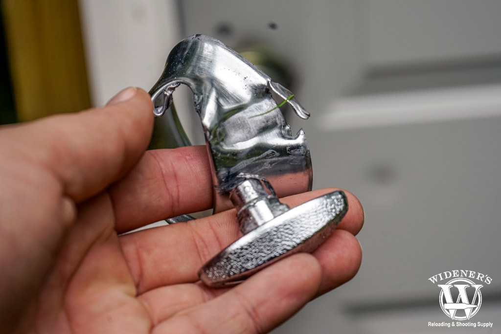 a photo of shooting a deadbolt