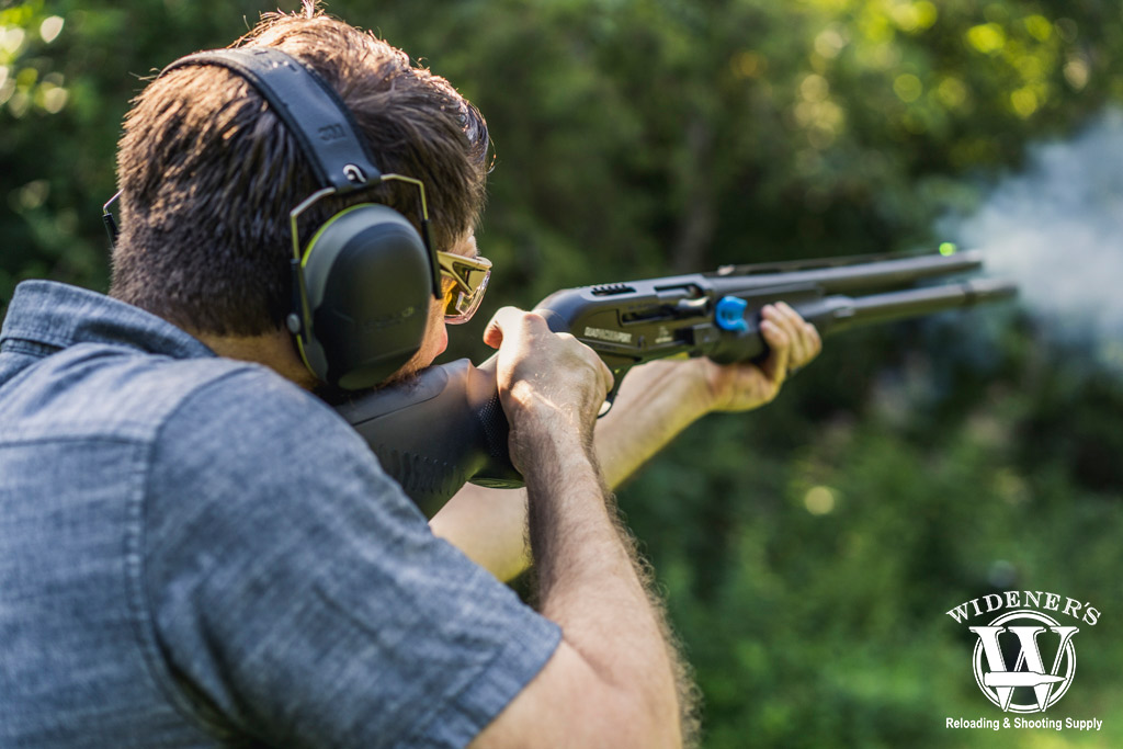 trapshooting with a semi-auto shotgun a photo of a man trapshooting with a semi-auto shotgun