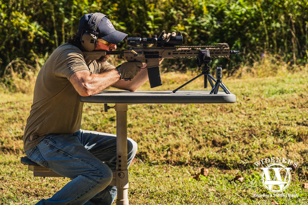 photo of a man shooting a rifle a photo of a man shooting a rifle