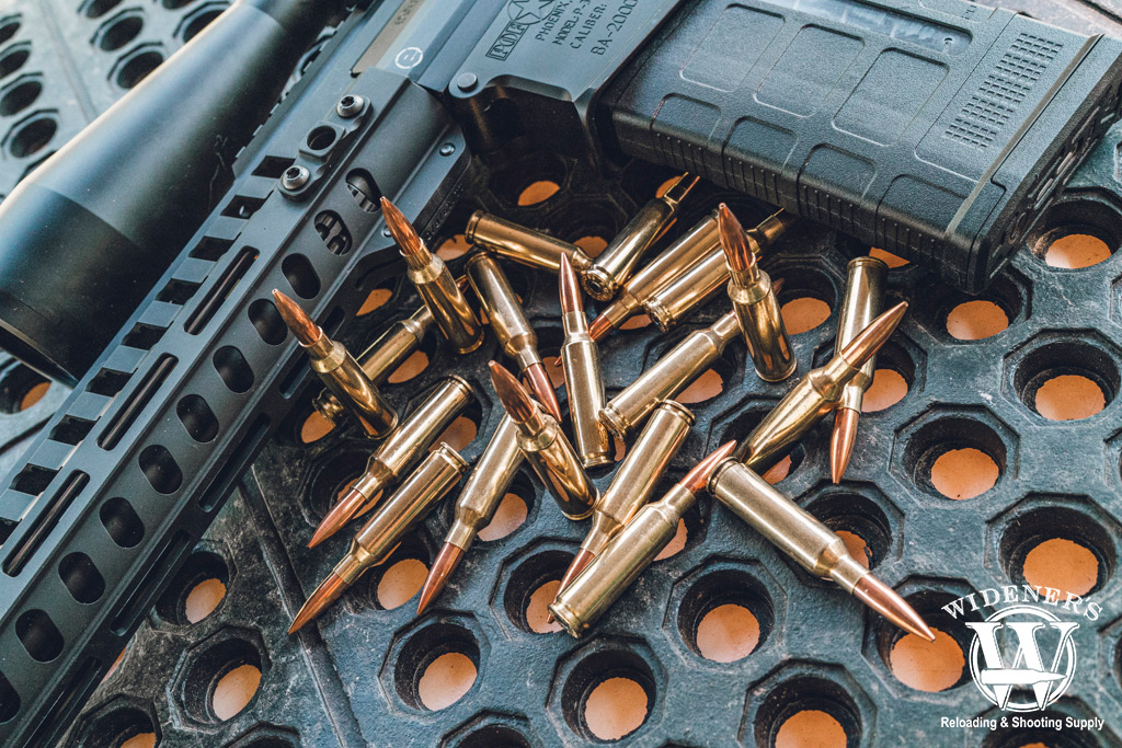 a photo of 6.5 creedmoor ammo with a rifle