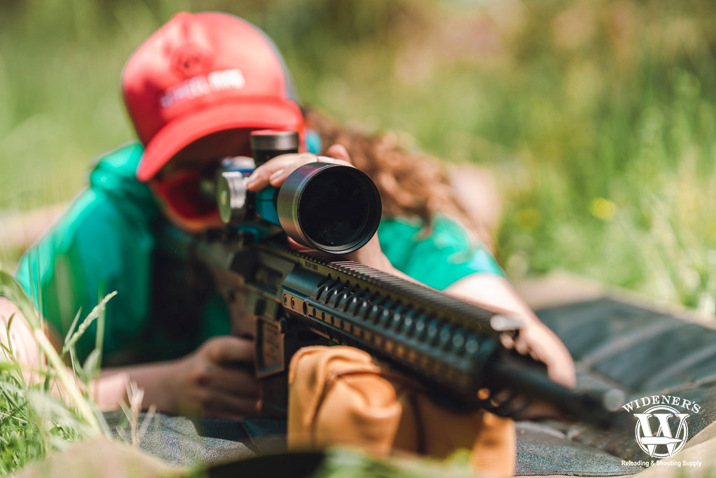 woman shooting an ar-10 semi auto rifle a photo of a woman shooting an ar-10 semi auto rifle