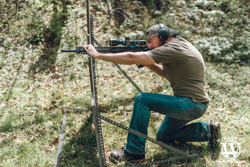 a man shooting a 308 semi auto rifle a photo of a man shooting a 308 semi auto rifle