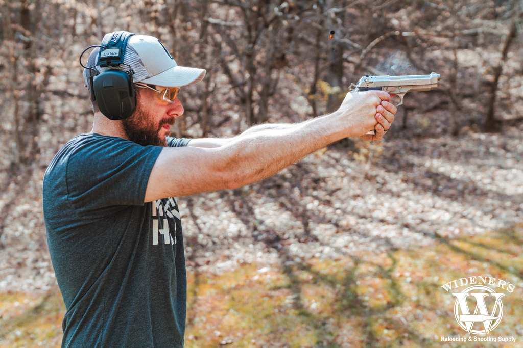 man shooting a beretta pistol a photo of a man shooting a beretta pistol