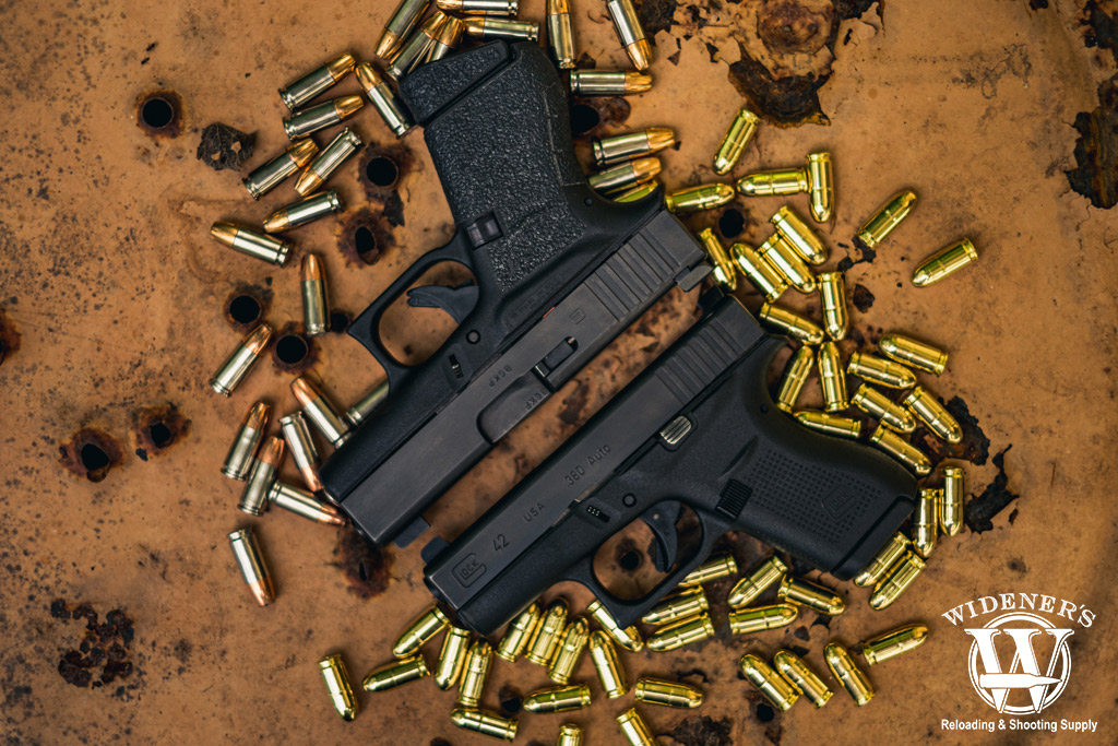 a photo of a glock 42 pistol and a glock 43 pistol with ammo
